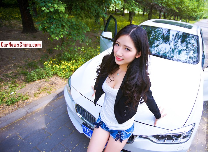 Pretty Chinese Girl is very Happy with BMW 320Li